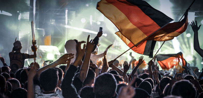 Large crowd waving German flags