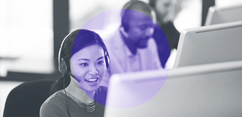 Call centre employees in front of computer screens