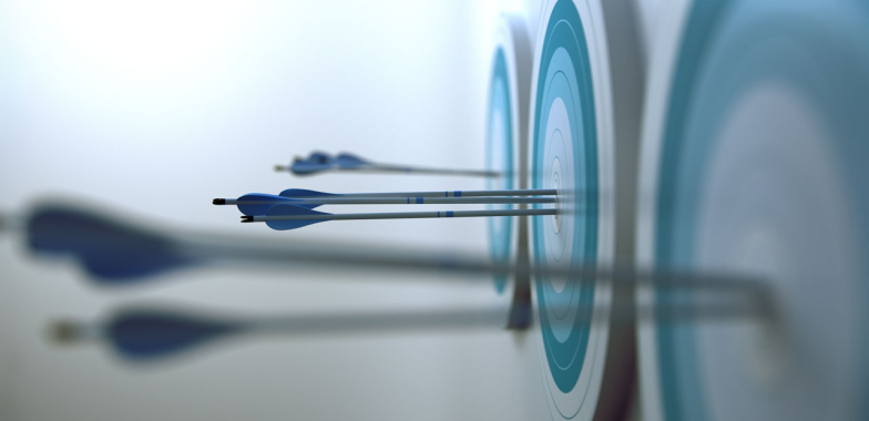 Archery target with arrows in the middle