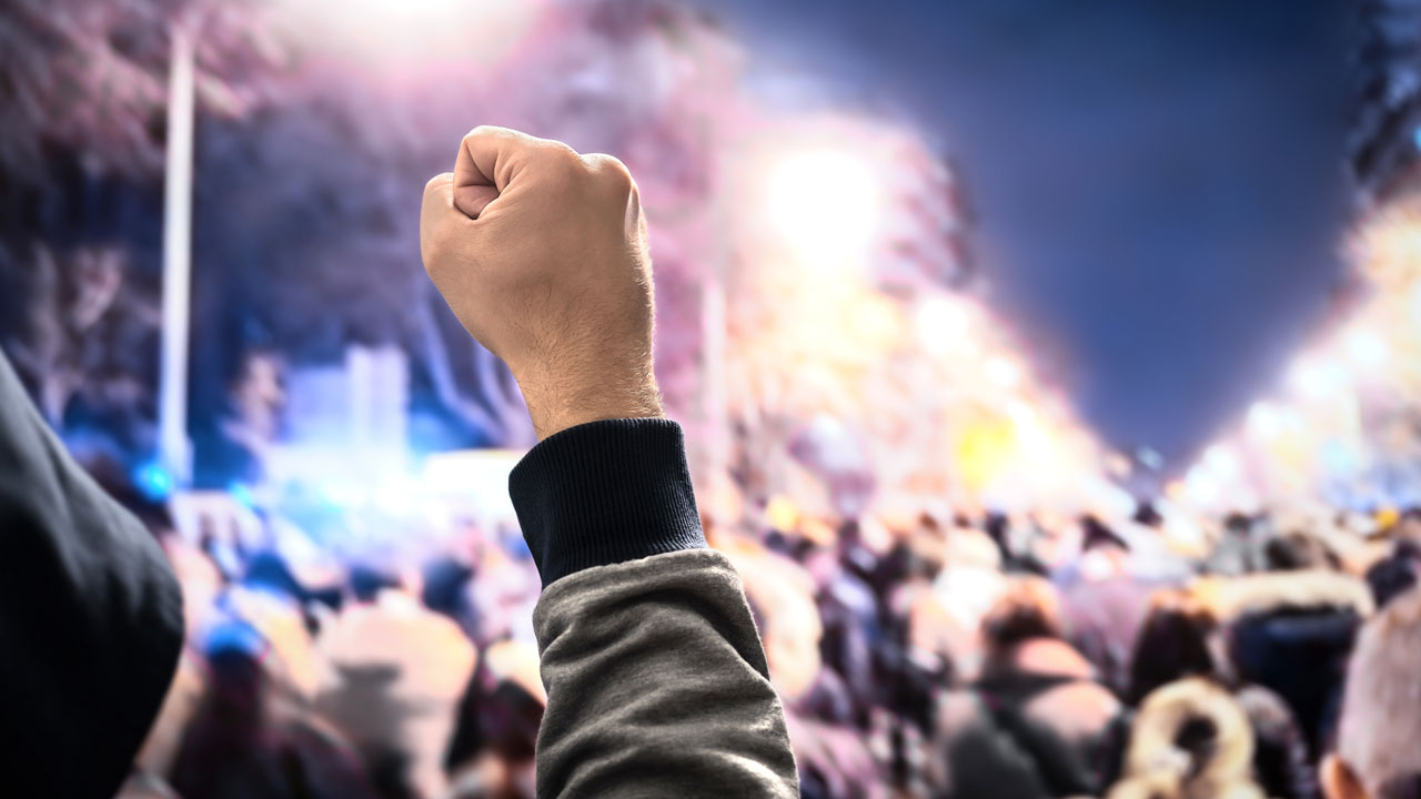 Protest man with fist raised